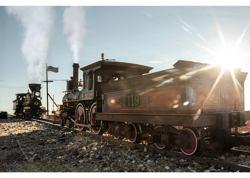 Golden Spike engines meet in sunlight